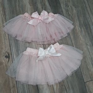 Two light pink tutus